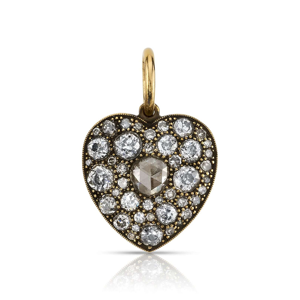 
Single Stone's Medium cobblestone heart pendant  featuring 0.28ct G-H/I1 rose cut diamond with 1.77ctw varying old cut and round brilliant cut diamonds set in a handcrafted, oxidized 18K yellow gold heart pendant. Charm measures 17mm x 19mm. Price does not include chain. 
*Cobblestone pattern may vary from piece to piece
