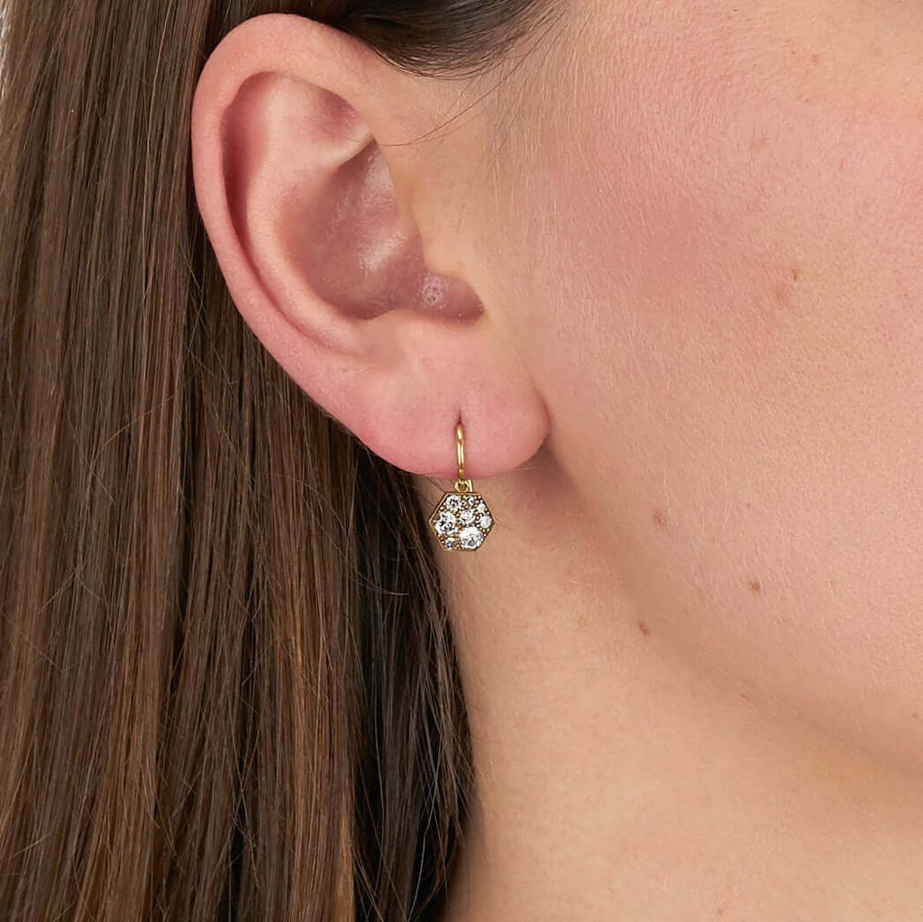 Single Stone's HEXAGON COBBLESTONE DROPS earrings  featuring 0.60ctw varying old cut and round brilliant cut diamonds set in handcrafted, oxidized 18K yellow gold drop earrings. Price may vary according to diamond weight. *Cobblestone pattern may vary from piece to piece
