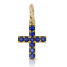 SINGLE STONE CARMELA CROSS WITH GEMSTONES PENDANT featuring Approximately 0.80ctw round cut gemstones set in a handcrafted 18K yellow gold cross. Cross measures 14.20mm x 17mm. Price does not include chain. Please inquire for additional customization.
