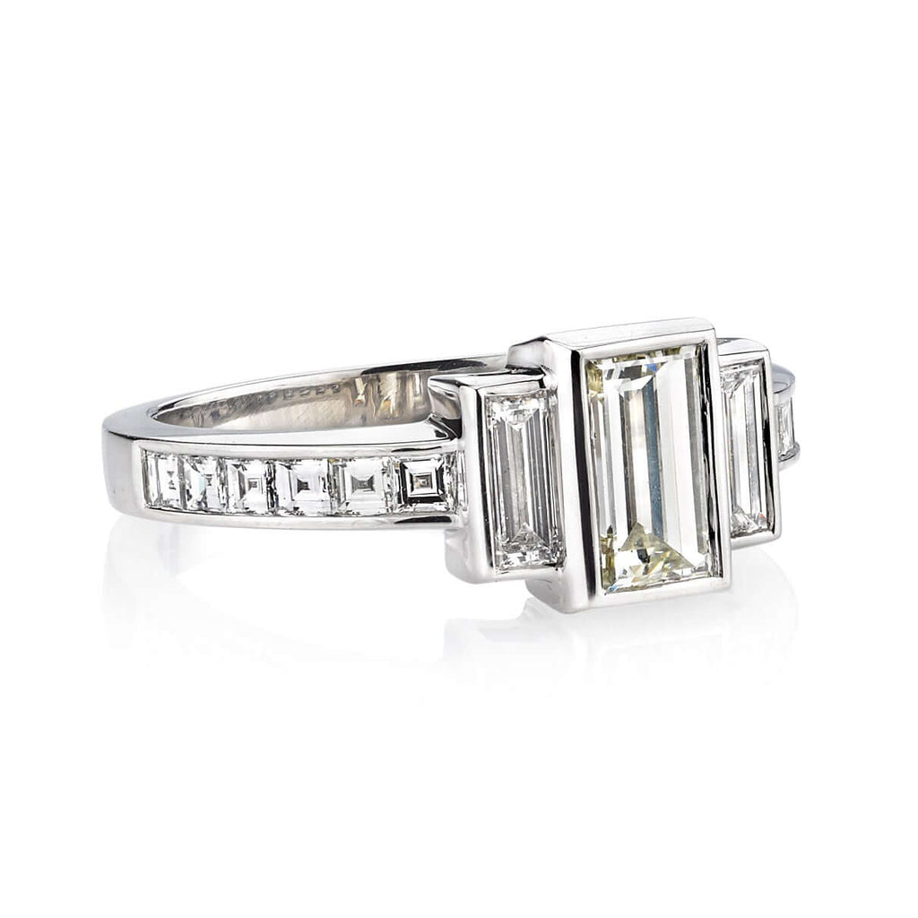 Single Stone's LISA ring  featuring 0.88ct L/VS1 GIA certified rectangular step cut diamond with 0.31ctw baguette cut accent diamonds and 0.41ctw carré cut accent diamonds set in a handcrafted platinum mounting.
