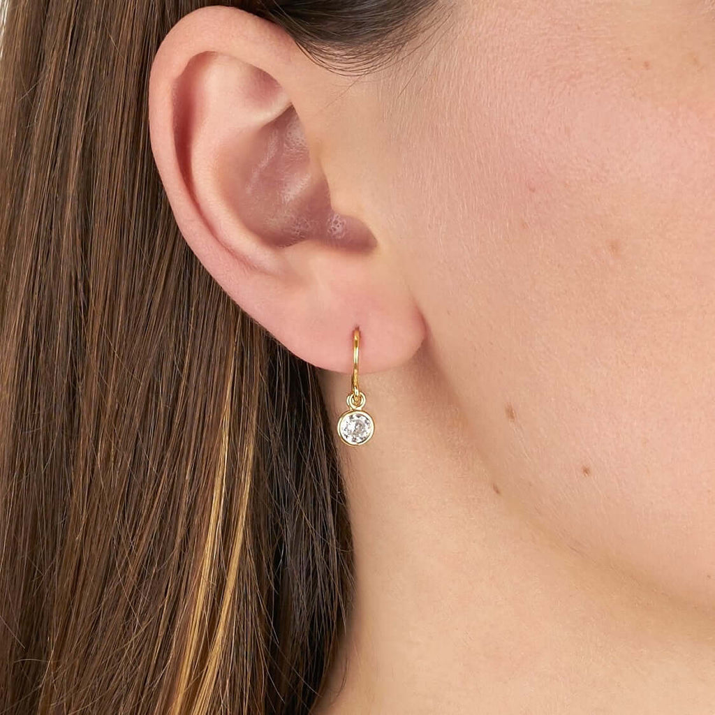 Single Stone's ANITA DROPS earrings  featuring 0.93ctw J-K/SI old European cut diamonds set in handcrafted 18K yellow gold drop earrings.
