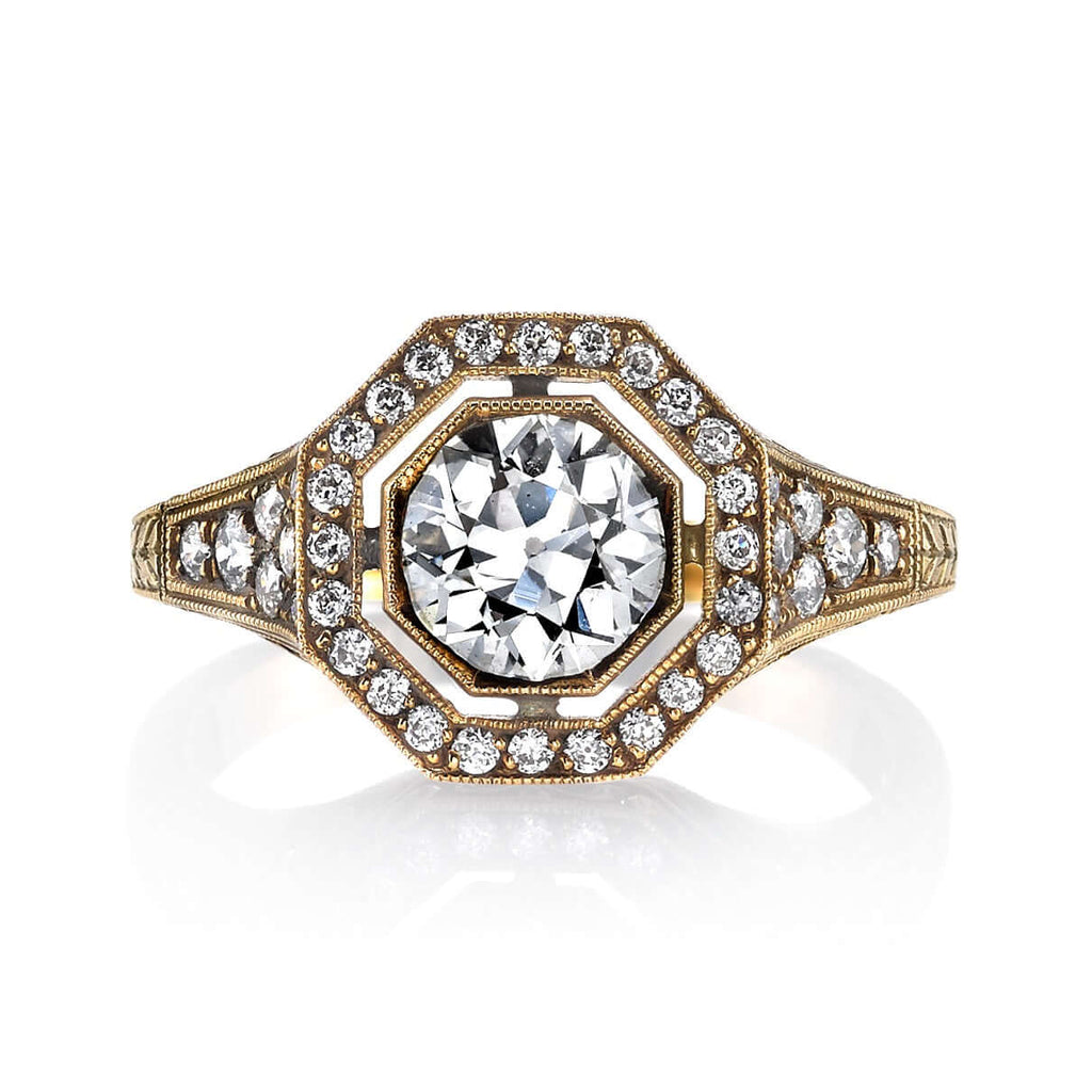 
Single Stone's Mckenna ring  featuring 0.97ct J/SI2 EGL certified old European cut diamond with 0.36ctw old European cut accent diamonds set in a handcrafted oxidized 18K yellow gold mounting.


