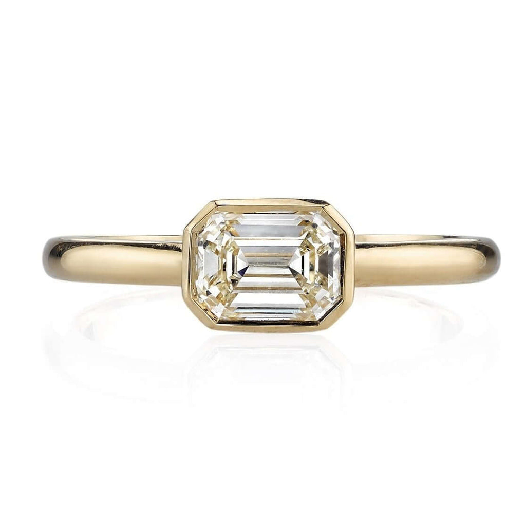 
Single Stone's Leah ring  featuring 1.03ctw J/VVS1 HRD certified emerald cut diamond set in a handcrafted 18K yellow gold mounting.

