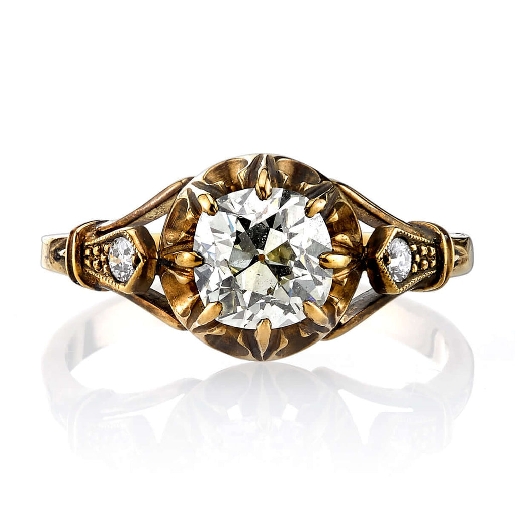 Single Stone's CLEO ring  featuring 1.07ct L/SI1 EGL certified antique cushion cut diamond with 0.06ctw old European cut accent diamonds set in a handcrafted oxidized 18K yellow gold mounting.
