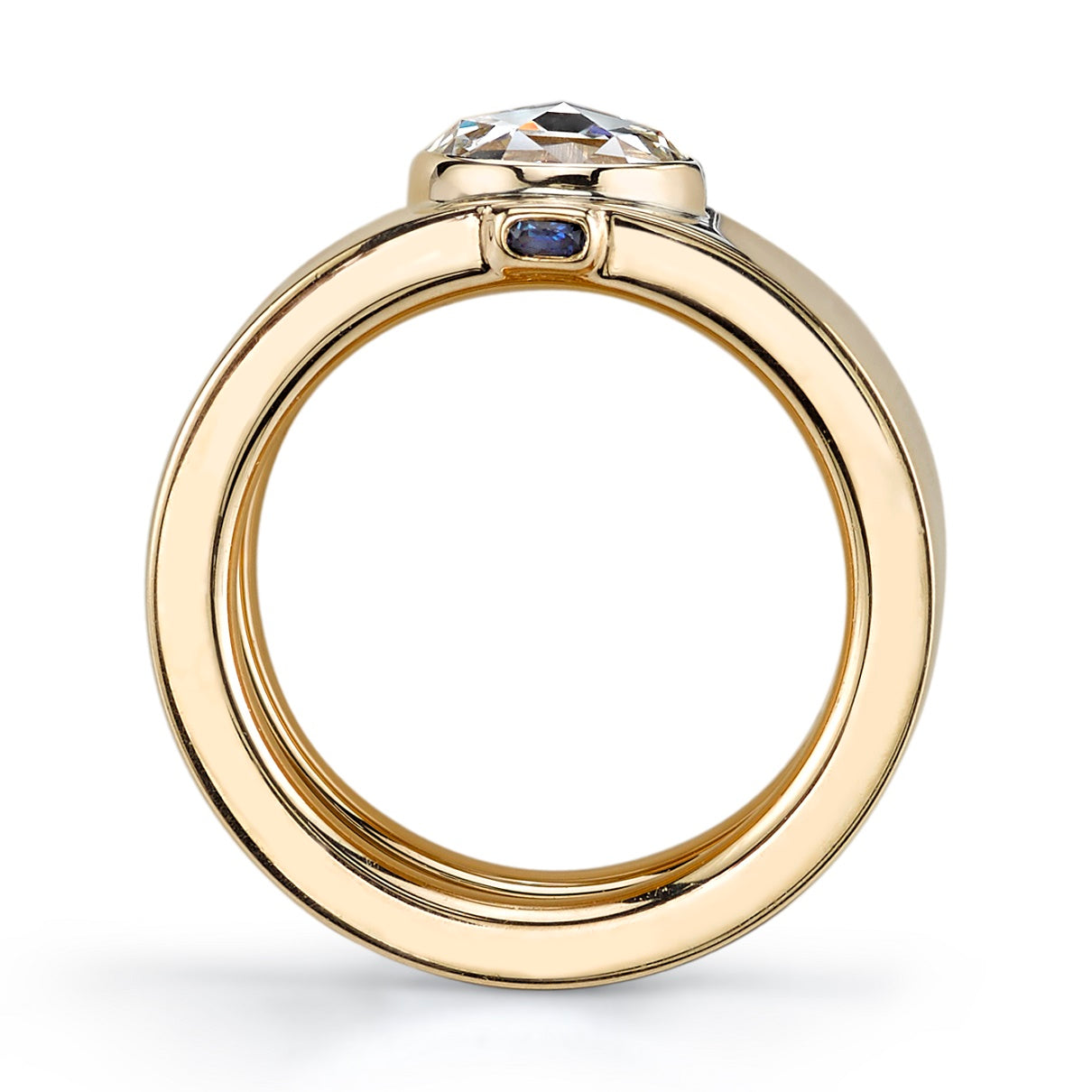 SINGLE STONE CYGALLE RING featuring 1.11ct I/VS2 GIA certified rose cut diamond set in a handcrafted 18K yellow gold band. Peeking out on the sides, you will find two blue sapphires.