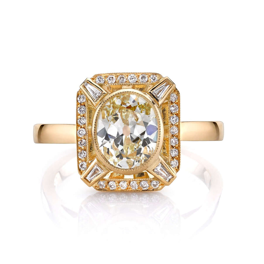 
Single Stone's Jennifer ring  featuring 1.31ct L/VS1 EGL certified antique oval cut diamond with 0.16ctw mixed cut accent diamonds set in a handcrafted 18K yellow gold mounting.

