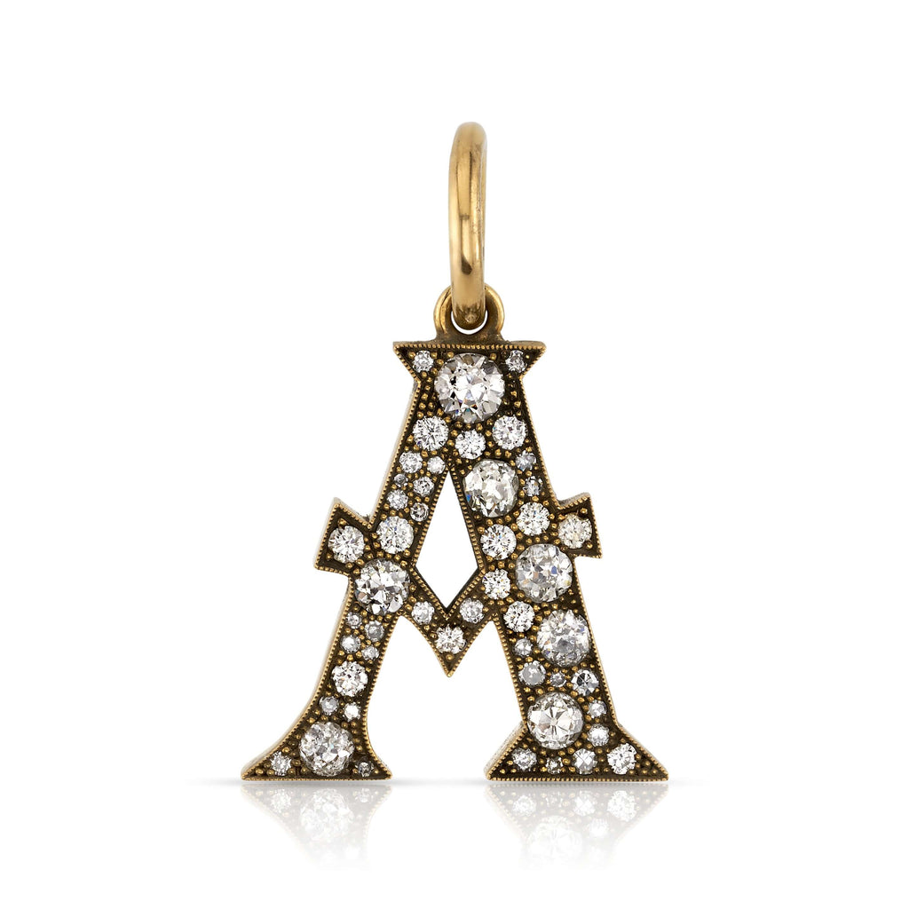 
Single Stone's Large cobblestone letters pendant  featuring Approximately 0.95ctw-2.75ctw varying old cut and round brilliant cut diamonds set in a handcrafted 18K yellow gold letter pendant. Letters are approximately 1" tall. Available in an oxidized or polished finish. Please inquire for additional customization. Price does not include chain, and may vary according to stone weight.
Click here to view all of our Cobblestone letters. 
*Cobblestone pattern may vary from piece to piece

