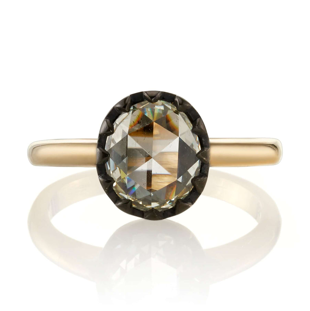 
Single Stone's Angelina ring  featuring 1.56ct L/SI2 GIA certified antique oval rose cut diamond set in an 18K yellow gold and oxidized silver mounting. 


