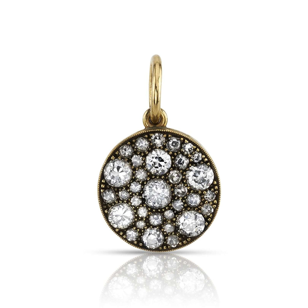 
Single Stone's Round cobblestone charm pendant  featuring Approximately 1.70ctw various old cut and round brilliant cut diamonds set in a handcrafted 18K yellow gold round cobblestone pendant. Charm measures approx. 15mm. Available in an oxidized or polished finish. Price does not include chain.
*Cobblestone pattern may vary from piece to piece
