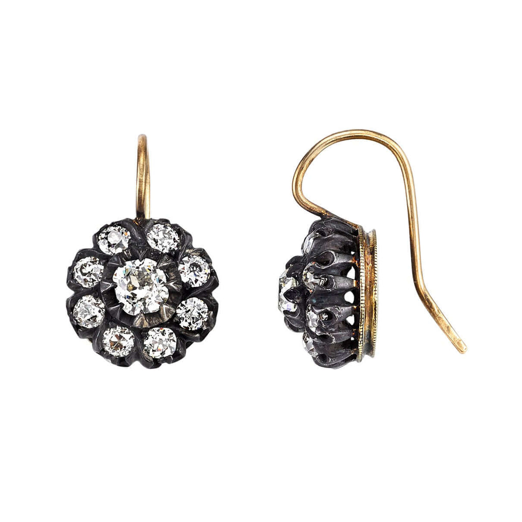 
Single Stone's Marissa drops earrings  featuring 1.83ctw J-K/VS old European cut diamonds prong set in handcrafted oxidized 18K yellow gold and silver cluster earrings.
