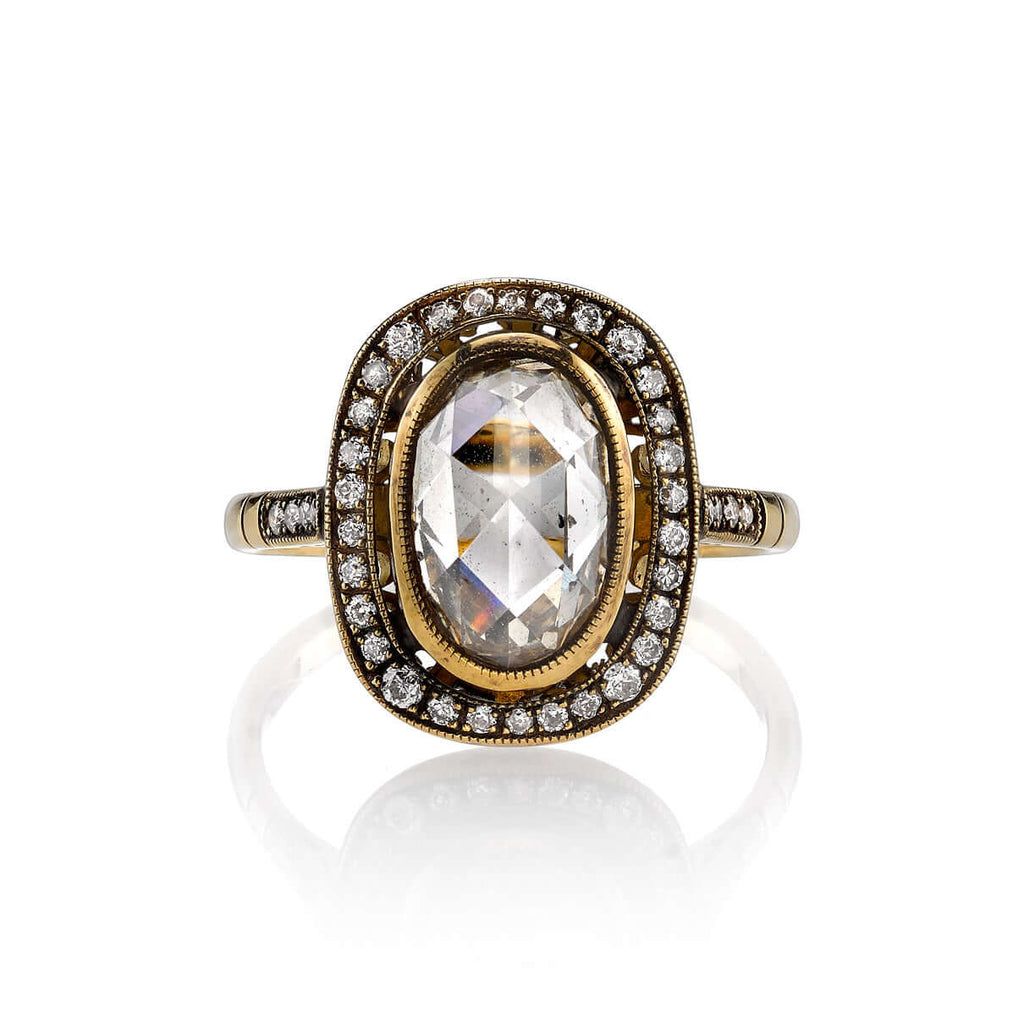 
Single Stone's Camille ring  featuring 2.12ct Brown/SI oval shaped rose cut diamond with 0.18ctw old European cut accent diamonds set in a handcrafted oxidized 18K yellow gold mounting.

