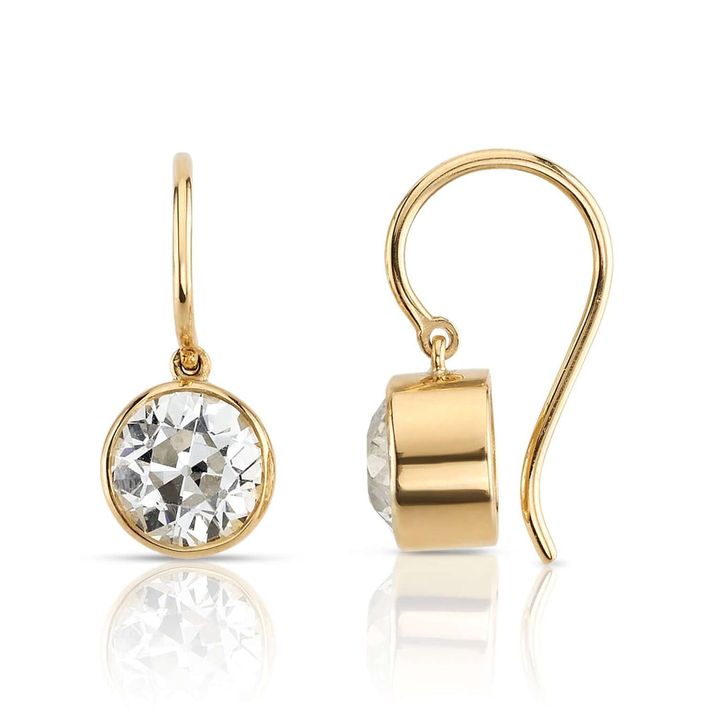 
Single Stone's Lucia drops earrings  featuring 2.49ctw K/VSI-VS2 GIA certified old European cut diamonds bezel set in handcrafted 18K yellow gold drop earrings.

