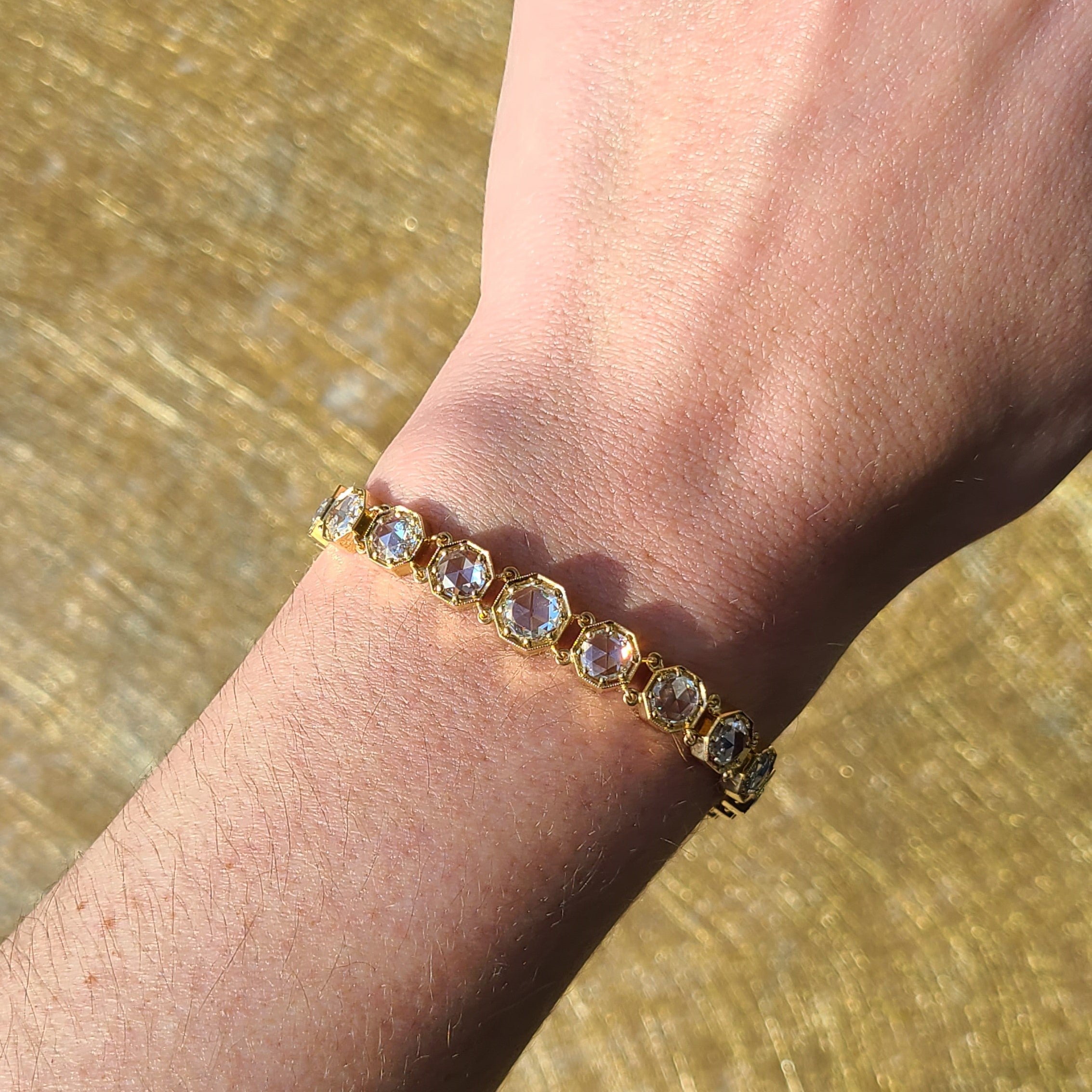 SINGLE STONE COLBY BRACELET featuring 1.10ct I/SI2 GIA certified round rose cut diamond accompanied by 7.94ctw round rose cut diamonds prong set in a handcrafted 18K yellow gold bracelet. Bracelet measures 7.5".