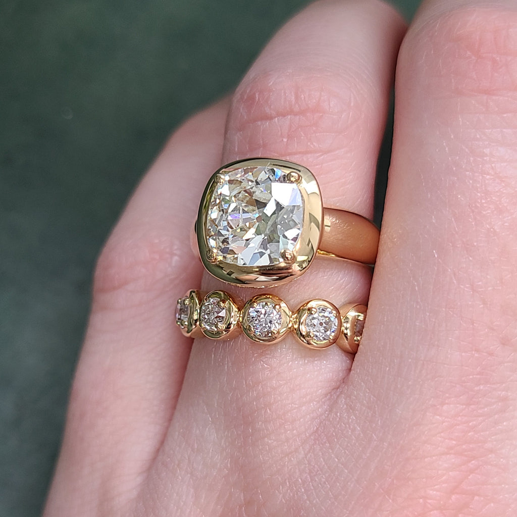 Single Stone's RANDI band  featuring Approximately 1.90ctw G-H/VS-SI old European cut diamonds prong set in a handcrafted 18K yellow gold eternity band.
