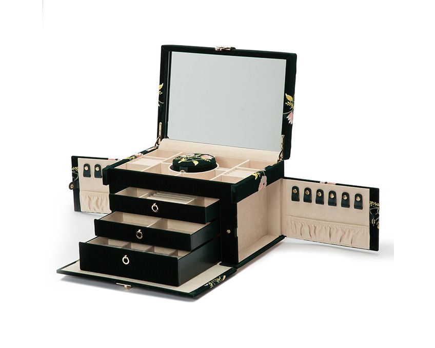 Single Stone's LARGE ZOE JEWELRY CASE  featuring Forest green velvet jewelry case embroidered with classic floral designs. Jewelry case includes a total of 20 compartments. Ring rolls (18), necklace storage (12), bracelet compartment (5), bracelet/watch cuff (6), and a removable mini travel piece (1). LusterLoc™: Allows the fabric lining the inside of your jewelry ca
