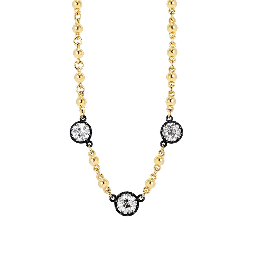 
Single Stone's Three stone rosalina necklace ring  featuring 2.97ctw K-L/VS1-I1 GIA certified old European cut diamonds prong set on a handcrafted 18K yellow gold and oxidized sterling silver necklace. 
Necklace measures 17.75"
 
