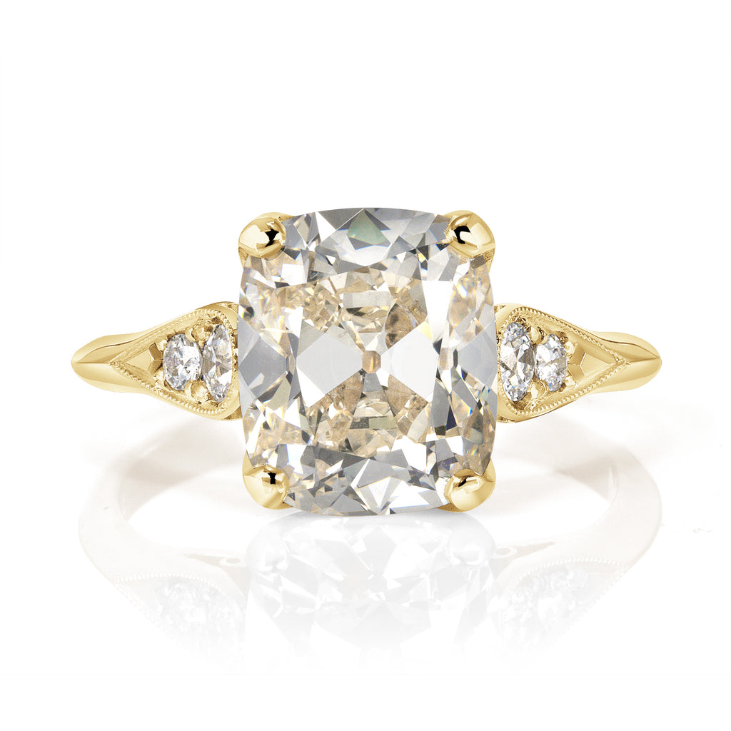 
Single Stone's Amanda ring  featuring 3.35ct N/SI1 GIA certified antique cushion cut diamond with 0.16ctw old European cut accent diamonds prong set in a handcrafted 18K yellow gold mounting.

 
