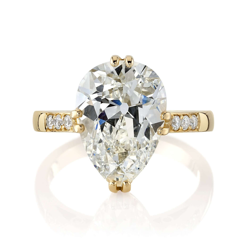 Single Stone's BAUER ring  featuring 5.00ct L/VVS1 GIA certified antique pear shaped diamond with 0.11ctw old European cut accent diamonds set in a handcrafted 18K yellow gold mounting.
