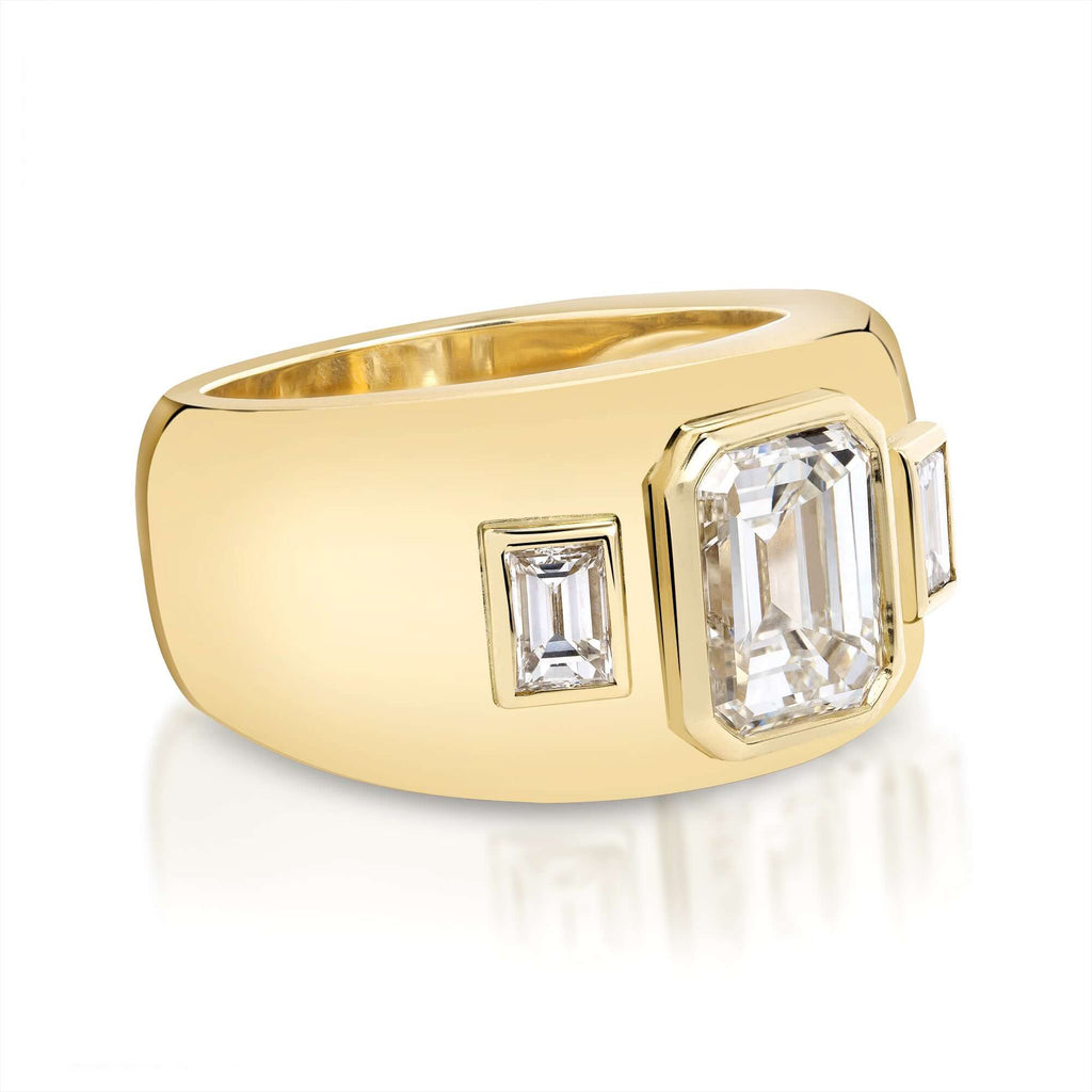 Single Stone's BEAUX ring  featuring 2.02ct K/VVS1 GIA certified emerald cut diamond with 0.34ctw baguette cut accent diamonds bezel set in a handcrafted 18K yellow gold mounting.  
