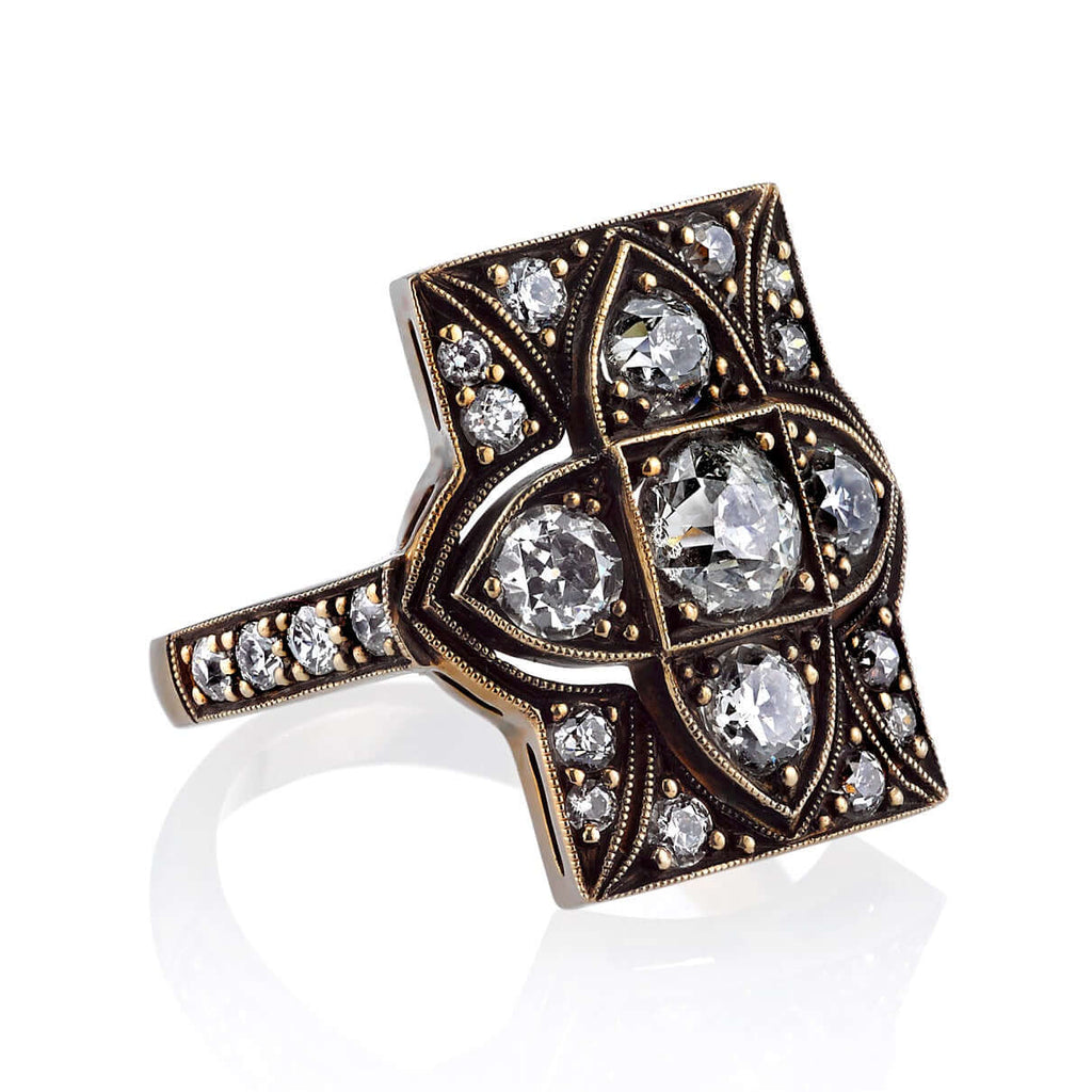 Single Stone's BRITTON ring  featuring 0.80ct J/SI1 antique old mine cut diamond with 1.61ctw mixed cut accent diamonds set in a handcrafted oxidized 18K champagne white gold mounting. Available in a polished or oxidized finish.
