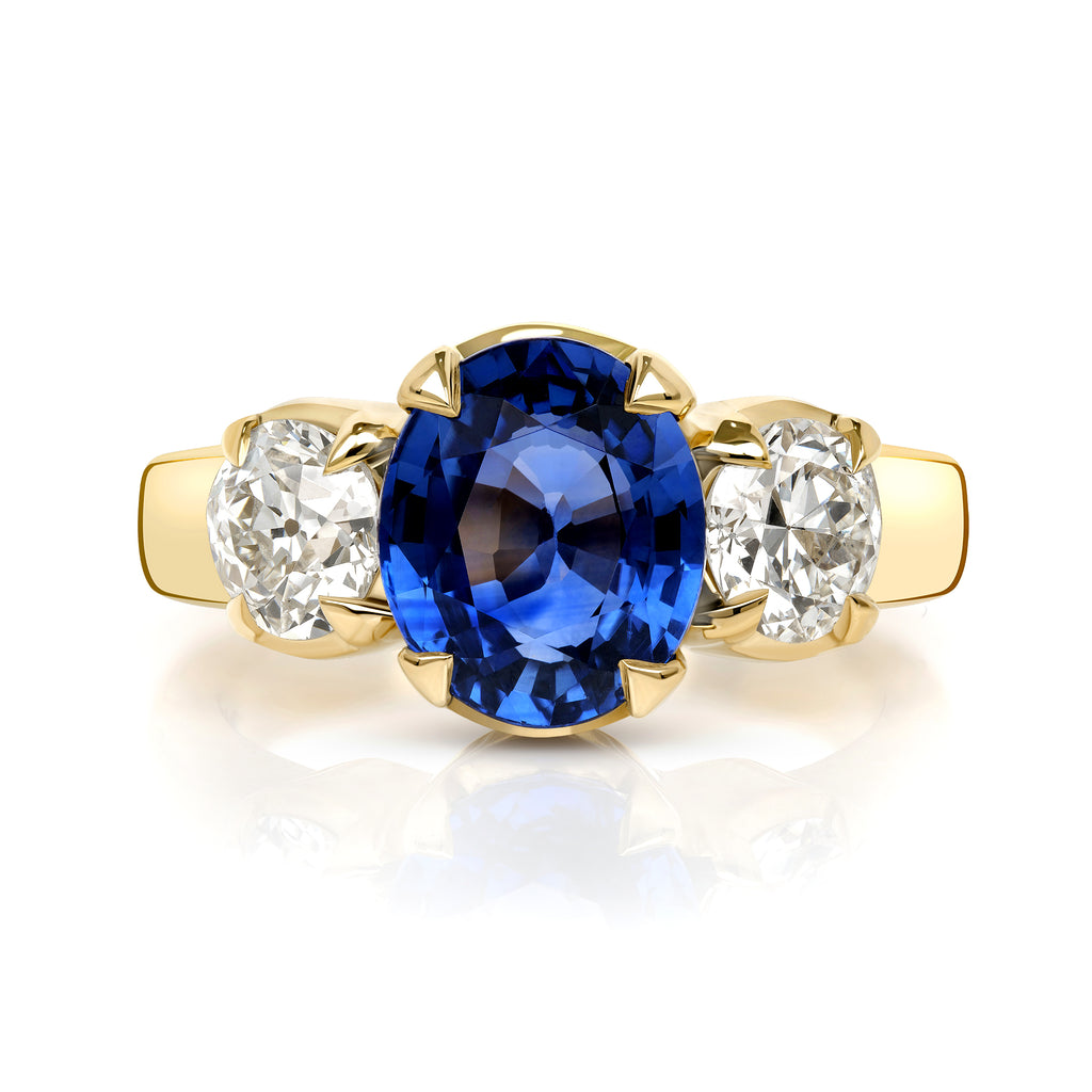 
Single Stone's Brooklyn ring  featuring 3.10ct GIA certified oval cut blue sapphire with 1.12ctw I-J/VS2-SI1 GIA certified old European cut accent diamonds prong set in a handcrafted 18K yellow gold mounting. 
 
