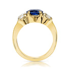 SINGLE STONE BROOKLYN RING featuring 3.10ct GIA certified oval cut blue sapphire with 1.12ctw I-J/VS2-SI1 GIA certified old European cut accent diamonds prong set in a handcrafted 18K yellow gold mounting.