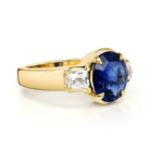 SINGLE STONE BROOKLYN RING featuring 3.24ct GIA certified Sri Lankan oval cut blue sapphire with 0.88ctw French cut accent diamonds prong set in a handcrafted 18K yellow gold mounting.