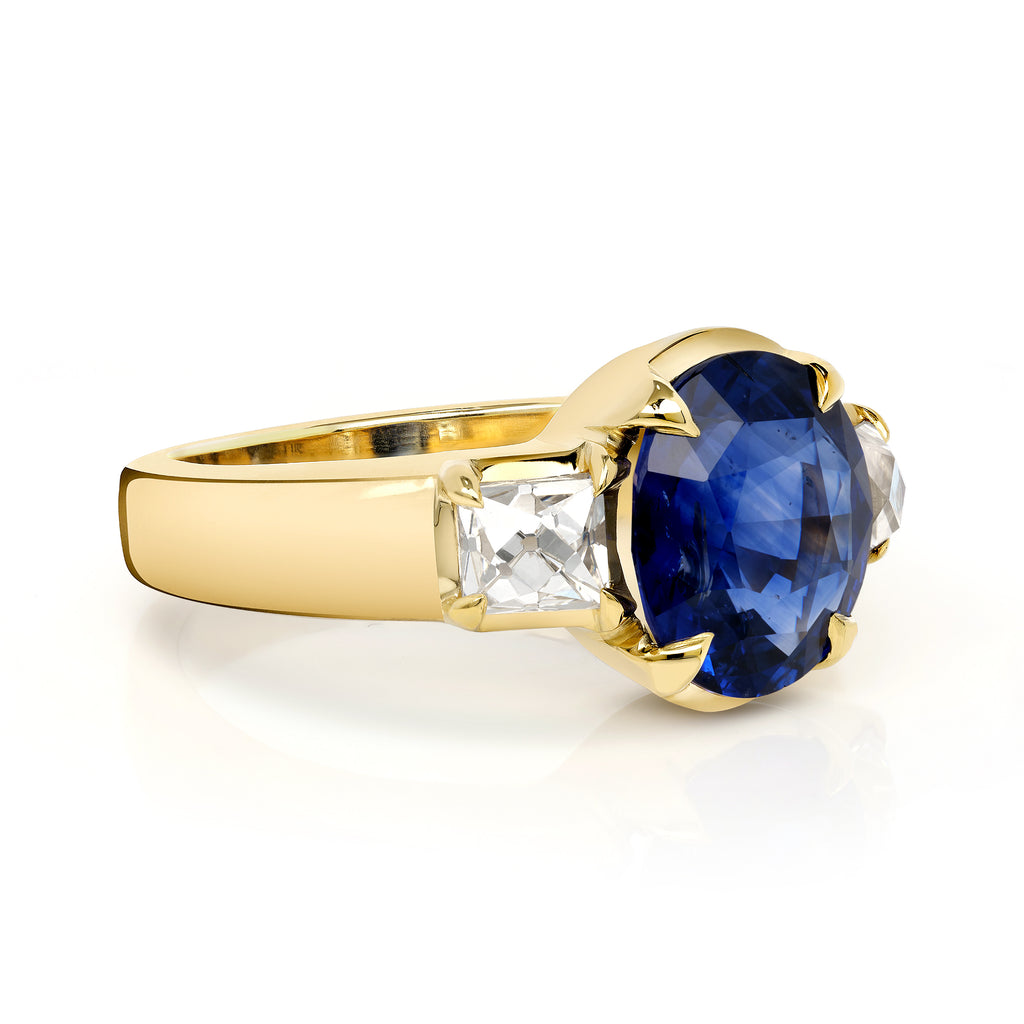 Single Stone's BROOKLYN ring  featuring 3.24ct GIA certified Sri Lankan oval cut blue sapphire with 0.88ctw French cut accent diamonds prong set in a handcrafted 18K yellow gold mounting.
