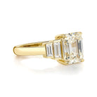SINGLE STONE CAROLINE RING featuring 2.31ct K/VS1 GIA certified emerald cut diamond with 0.44ctw baguette cut accent diamonds prong set in a handcrafted 18K yellow gold mounting.