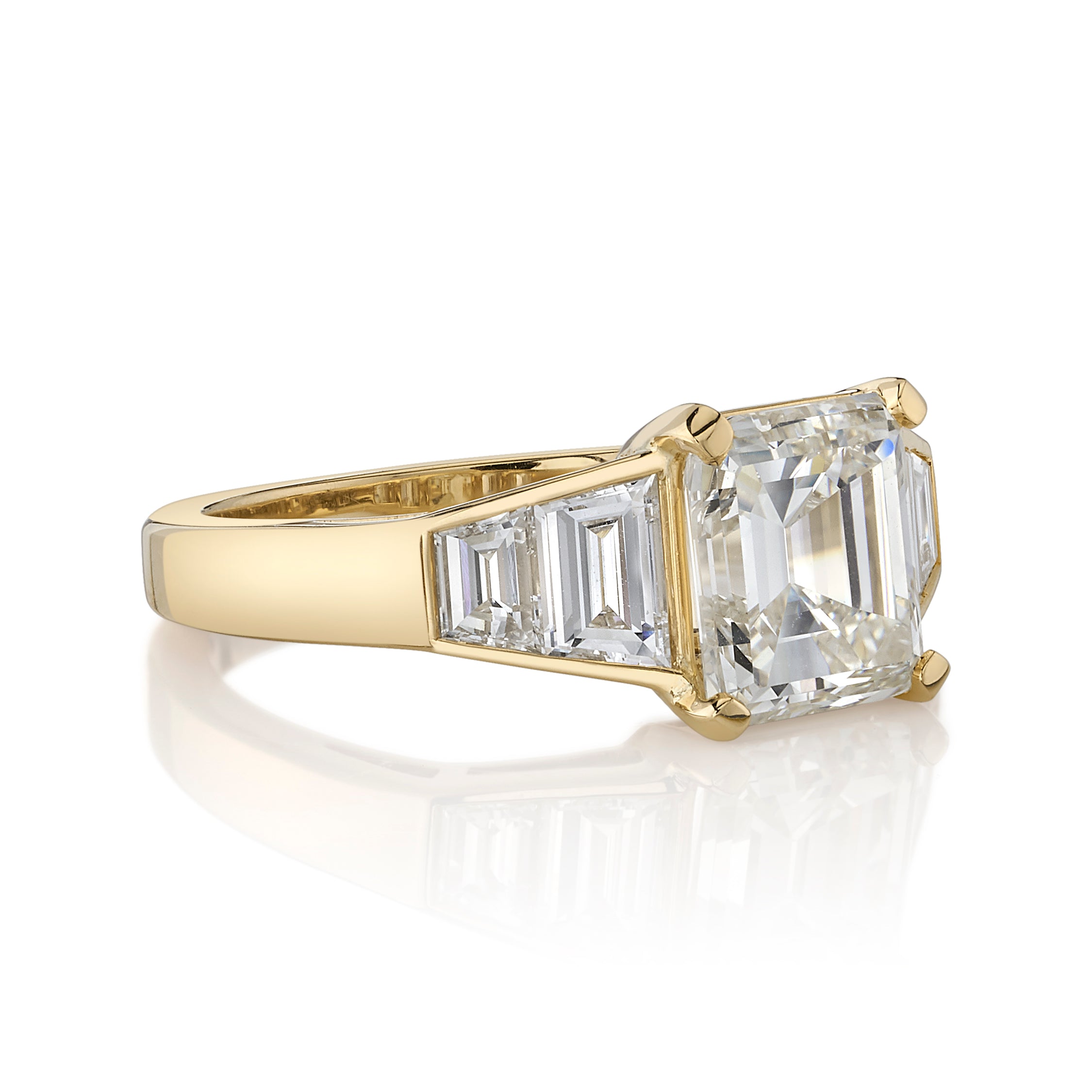SINGLE STONE CASSIDY RING featuring 2.60ct L/SI1 GIA certified vintage Asscher cut diamond with 0.86ctw trapezoid cut accent diamonds set in a handcrafted 18K yellow gold mounting.
