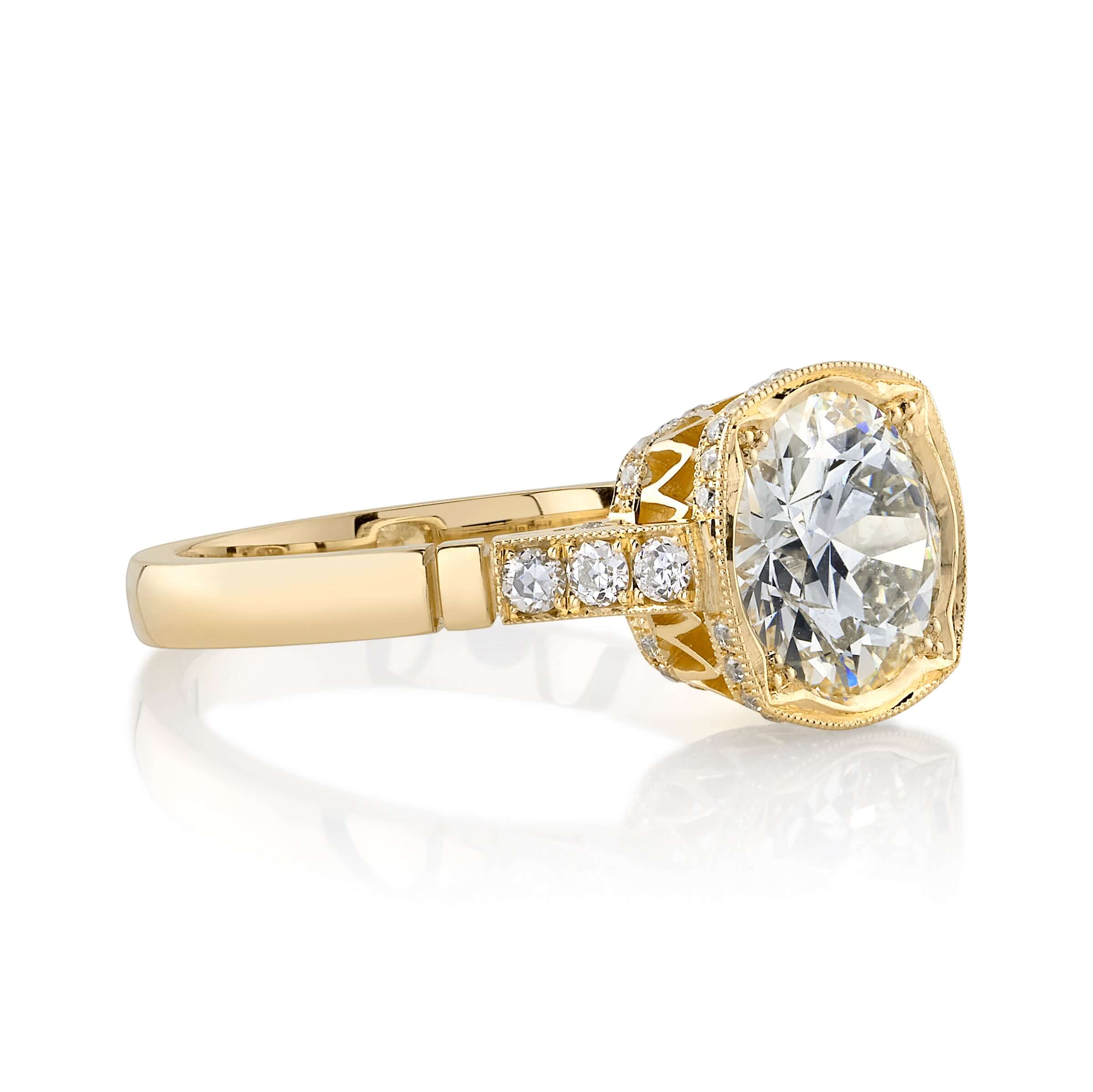 SINGLE STONE COLETTE RING featuring 1.73ct N/VVS2 GIA certified old European cut diamond with 0.25ctw old European cut accent stones set in a handcrafted 18K yellow gold mounting.