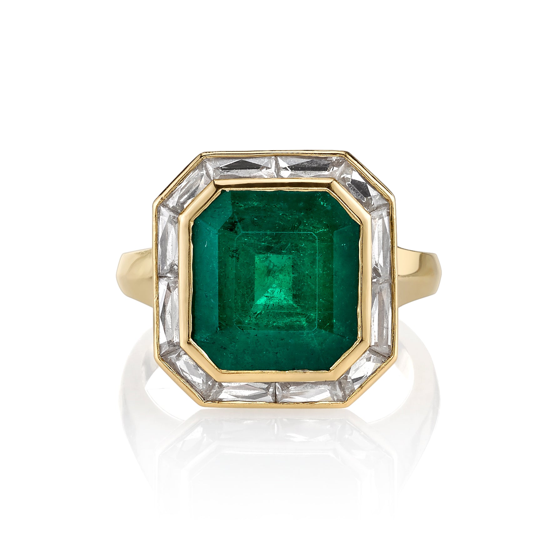 SINGLE STONE MARIA RING featuring 4.61ct cut Colombian emerald surrounded by approximately 1.65ctw French cut baguette accent diamonds set in a handcrafted 18K yellow gold ring.