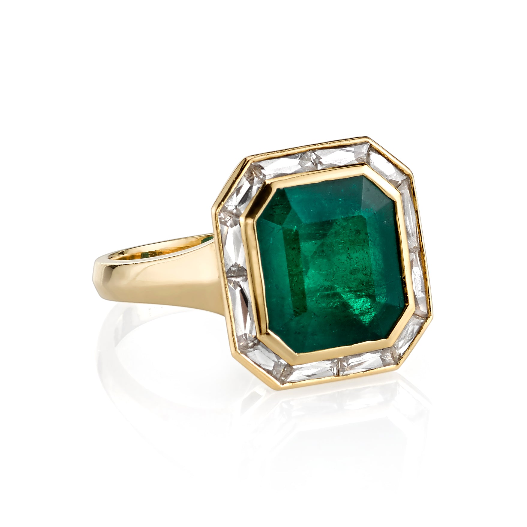 SINGLE STONE MARIA RING featuring 4.61ct cut Colombian emerald surrounded by approximately 1.65ctw French cut baguette accent diamonds set in a handcrafted 18K yellow gold ring.