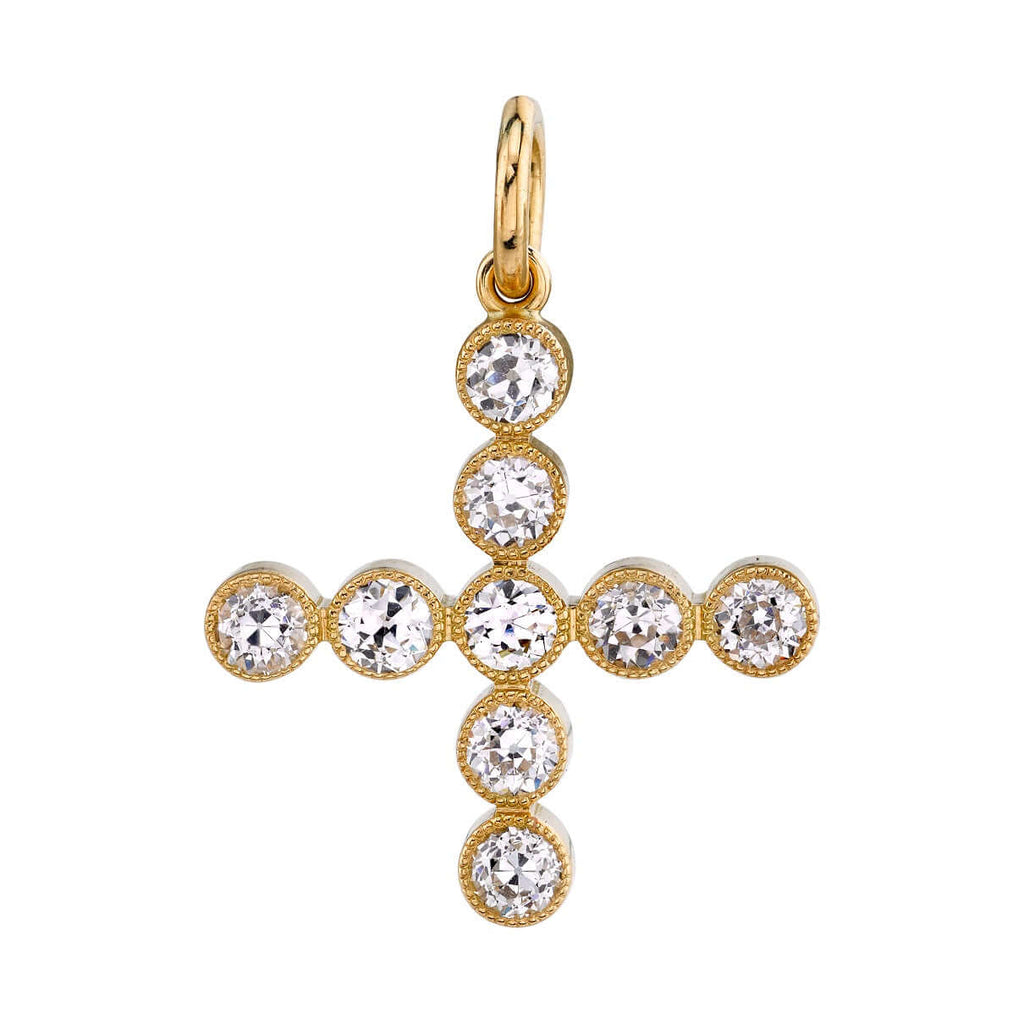 
Single Stone's Gabby cross pendant  featuring Approximately 1.10ctw G-H/VS-SI old European cut diamonds in a handcrafted 18K gold bezel set cross charm. Cross measures 20.6mm x 20.6mm. Price does not include chain.
 

