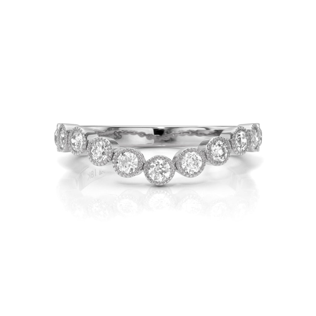 Single Stone's GABBY CURVED band  featuring Approximately 0.50ctw G-H/VS old European cut diamonds bezel set in a handcrafted 18K gold half-eternity band.
