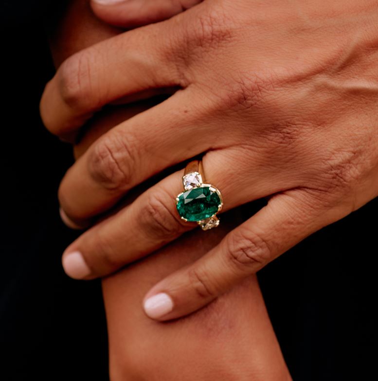 SINGLE STONE BROOKLYN RING featuring 6.08ct GIA certified Zambian cushion cut green emerald flanked by 1.61ctw GIA certified E-F/VS1 French cut diamonds prong set in a handcrafted 18K yellow gold mounting.