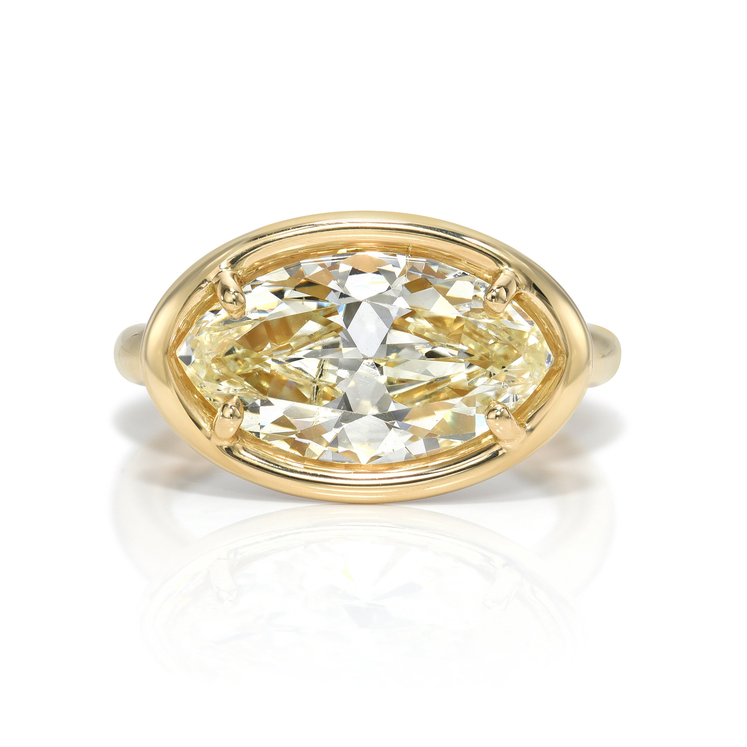 SINGLE STONE DEVI RING featuring 4.23ct S-T/SI2 GIA certified marquise cut diamond with 0.95ctw old European cut accent diamonds prong set in a handcrafted 18K yellow gold mounting.