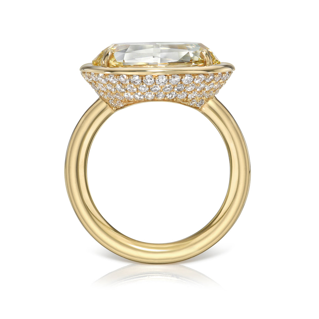 Single Stone's DEVI ring  featuring 5.21ct Fancy Lt. Brownish Yellow/SI2 GIA certified oval cut diamond with 0.85ctw old European cut accent diamonds set in a handcrafted 18K yellow gold mounting.
