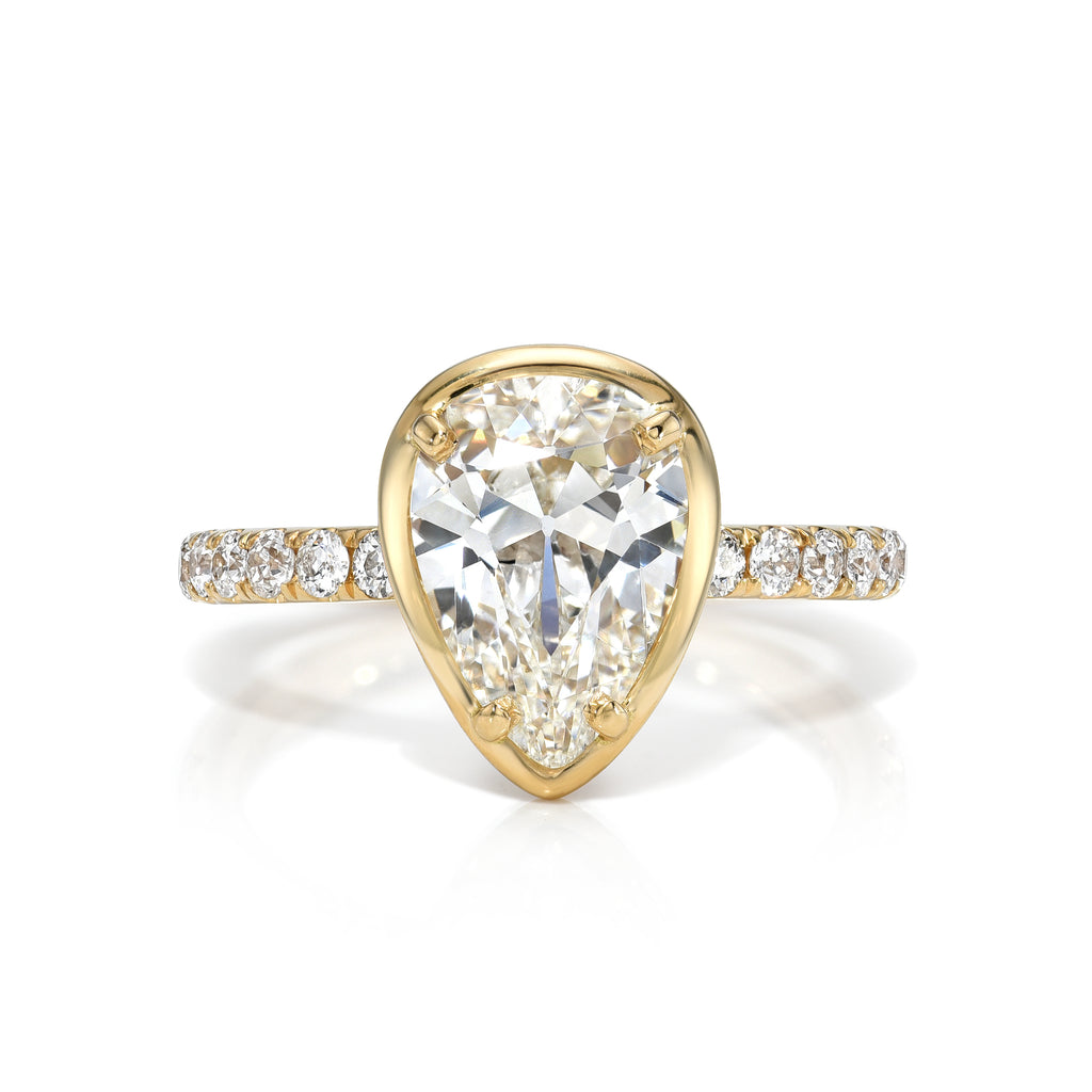 
Single Stone's Ella ring  featuring 2.13ct H/SI1 GIA certified pear shaped diamond with 0.36ctw old European cut accent diamonds prong set in a handcrafted 18K yellow gold mounting.
