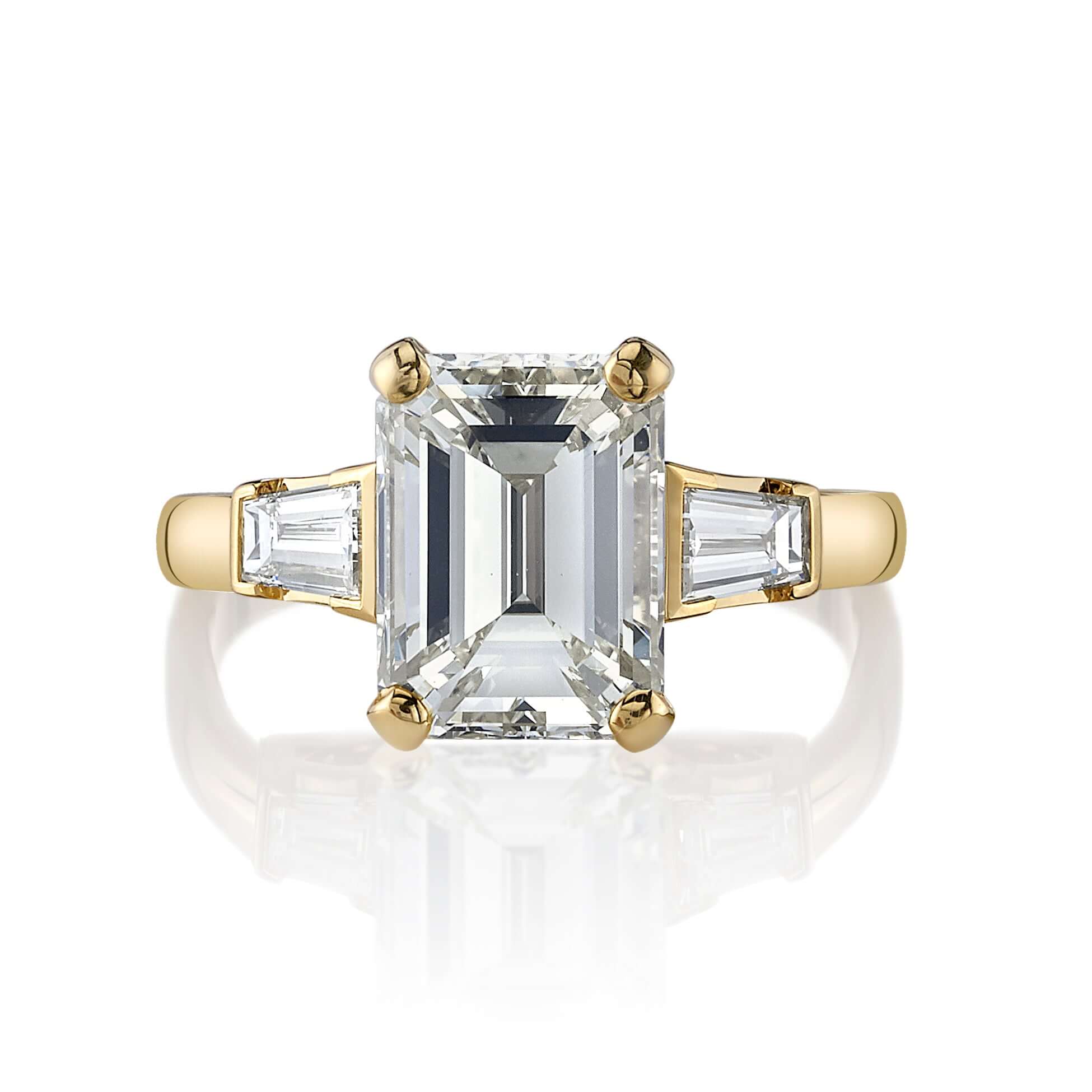 SINGLE STONE FAY RING featuring 3.30ct S-T/VVS2 GIA certified emerald cut diamond with 0.55ctw baguette cut accent diamonds prong set in a handcrafted 18K yellow gold setting.