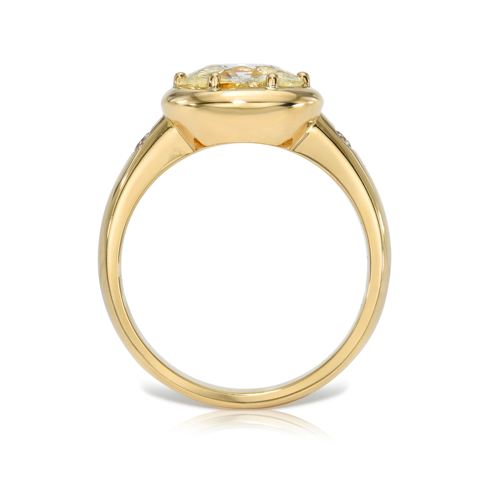 Single Stone's FRIDA ring  featuring 1.55ct L/VS2 GIA certified oval cut diamond with 0.07ctw old European cut accent diamonds prong set in a handcrafted 18K yellow gold mounting.
