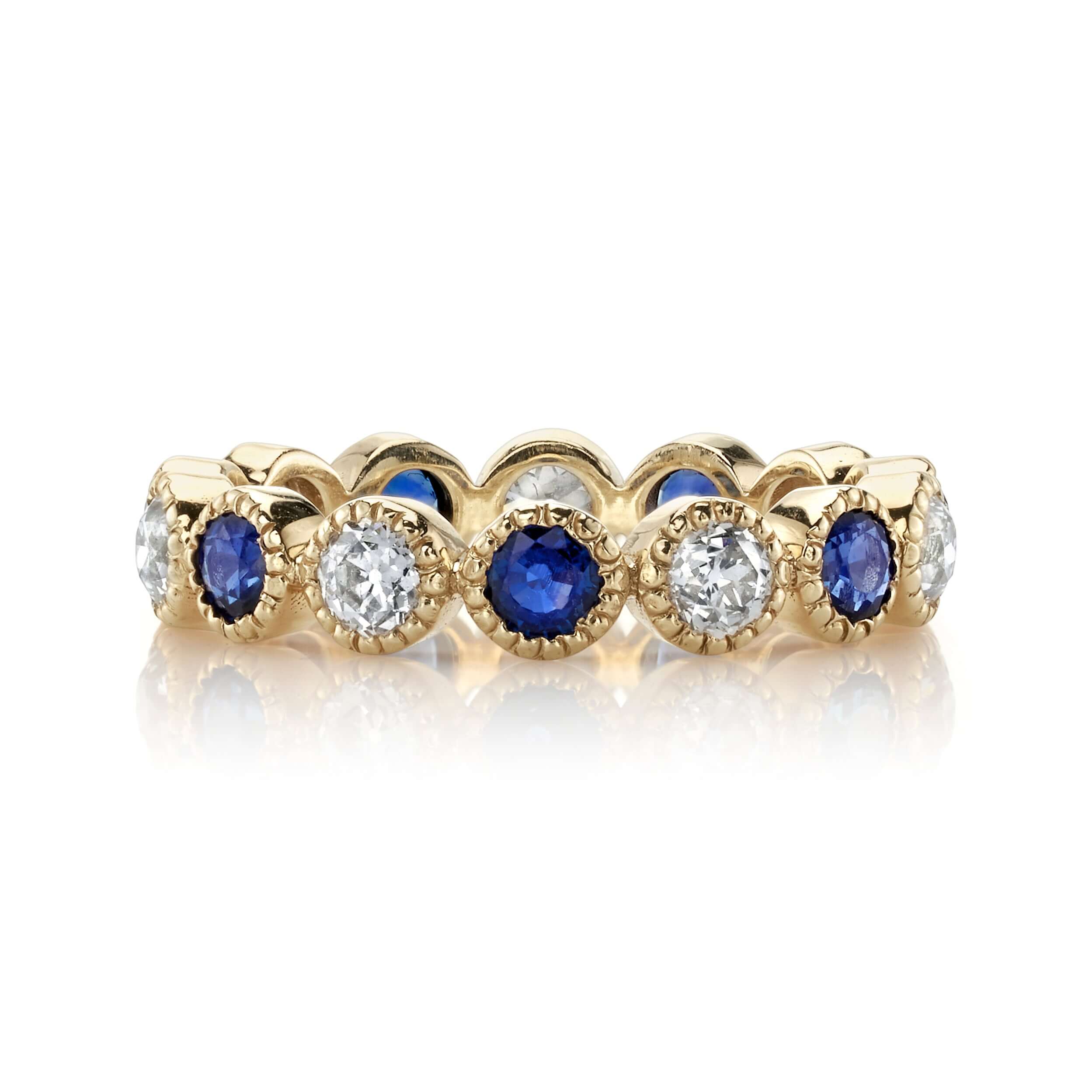 SINGLE STONE MEDIUM GABBY WITH DIAMONDS AND GEMSTONES BAND | Approximately 0.95ctw G-H/VS-SI old European cut diamonds and 1.20ctw round cut color gemstones set in a handcrafted bezel set eternity band. Approximate band width 3.6mm. Please inquire for add