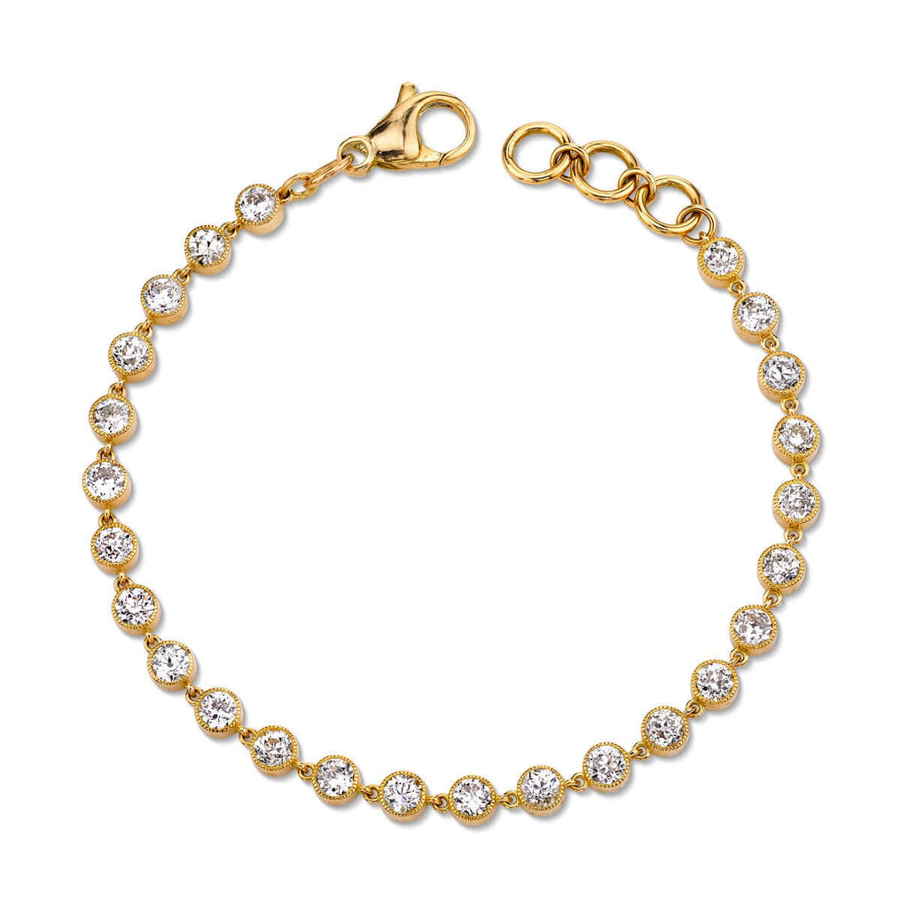 
Single Stone's Gabby bracelet band  featuring Approximately 5.30ctw G-H/VS-SI old European cut diamonds set in a handcrafted 18K yellow gold diamond tennis bracelet.  
Bracelet measures 7.5".
