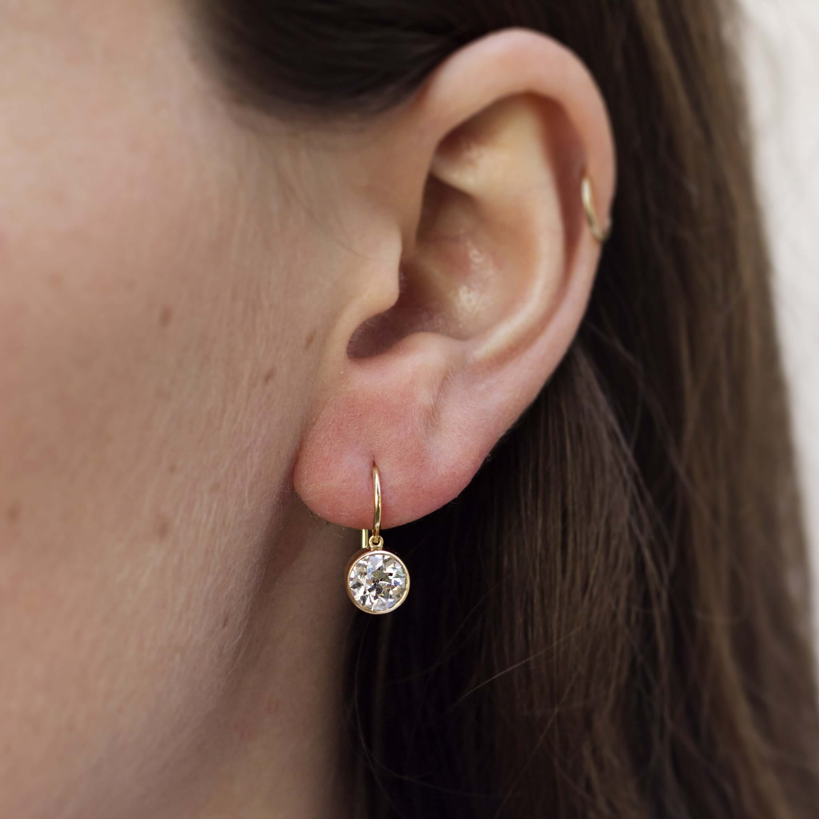 SINGLE STONE LUCIA DROPS | Earrings featuring 2.49ctwK/VSI-VS2 GIA certified oldEuropean cut diamonds bezel set in handcrafted 18K yellow gold drop earrings.