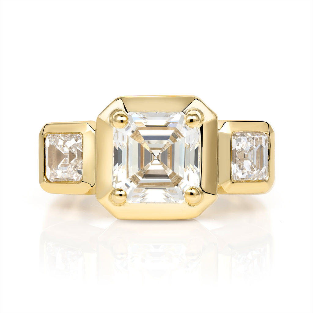 
Single Stone's Gloria ring  featuring 2.14ct K/VVS2 GIA certified Asscher diamond with 0.97ctw Asscher cut accent diamonds set in a handcrafted 18K yellow gold mounting.

