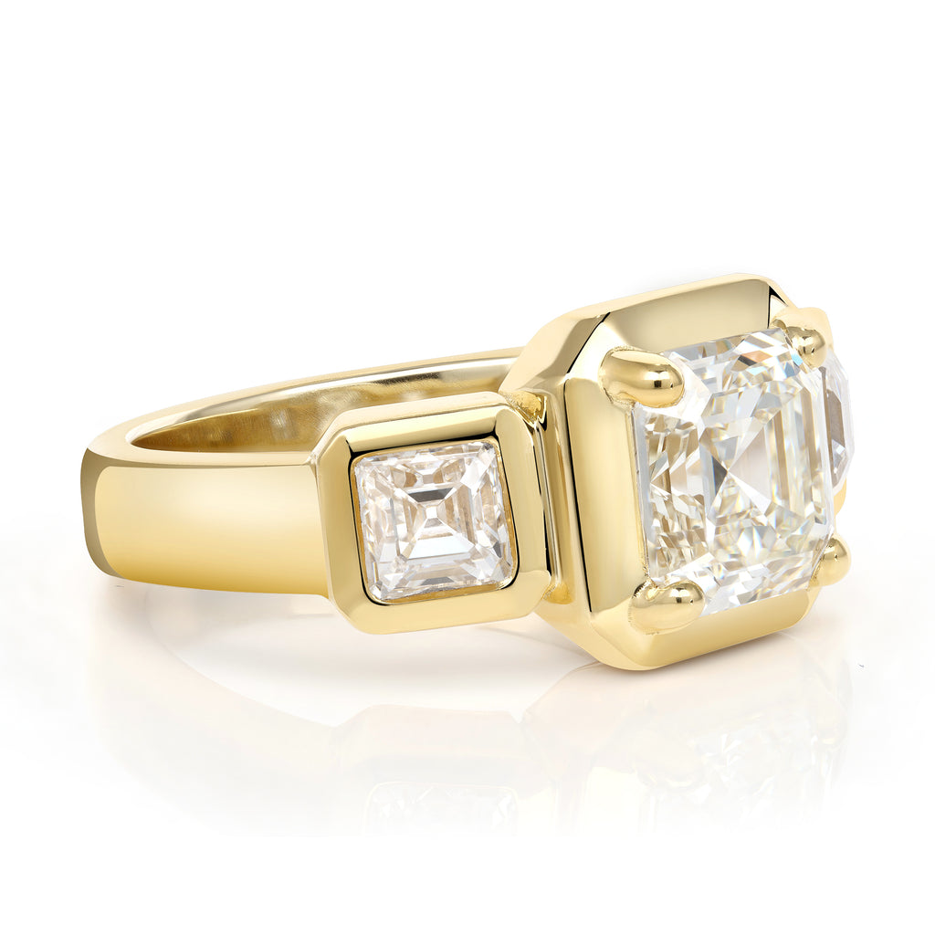 Single Stone's GLORIA ring  featuring 2.14ct K/VVS2 GIA certified Asscher diamond with 0.97ctw Asscher cut accent diamonds set in a handcrafted 18K yellow gold mounting.
