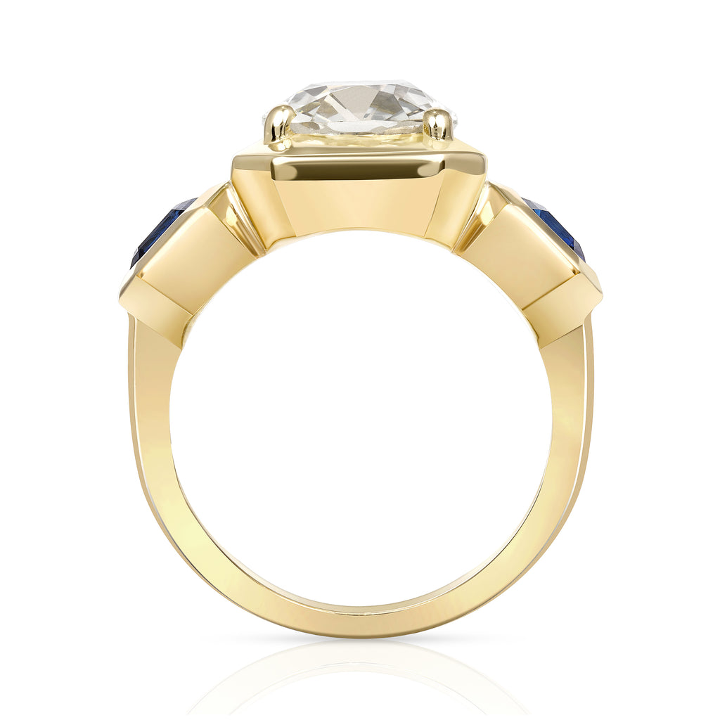 Single Stone's GLORIA ring  featuring 2.86ct O-P/I2 GIA certified antique cushion cut diamond with 1.50ctw Asscher cut blue sapphires set in a handcrafted 18K yellow gold mounting.  

