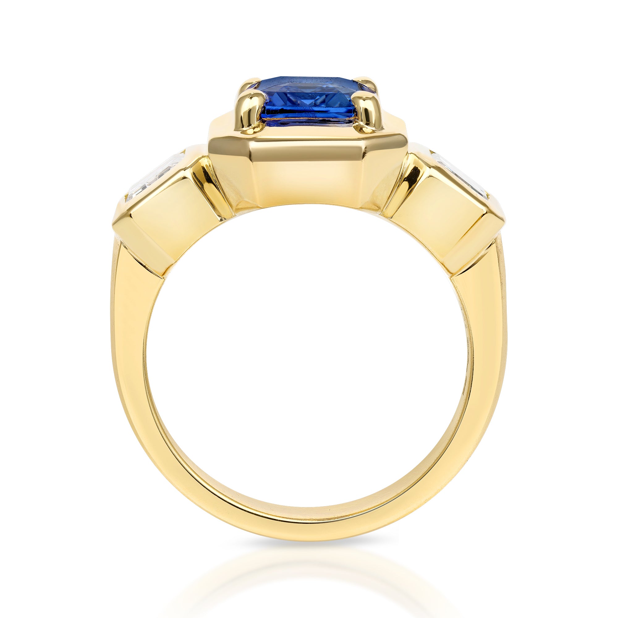SINGLE STONE GLORIA RING featuring 2.90ct Sri Lankan GIA certified emerald cut blue sapphire with 1.00ctw GIA certified emerald cut diamonds prong set in a handcrafted 18K yellow gold mounting.