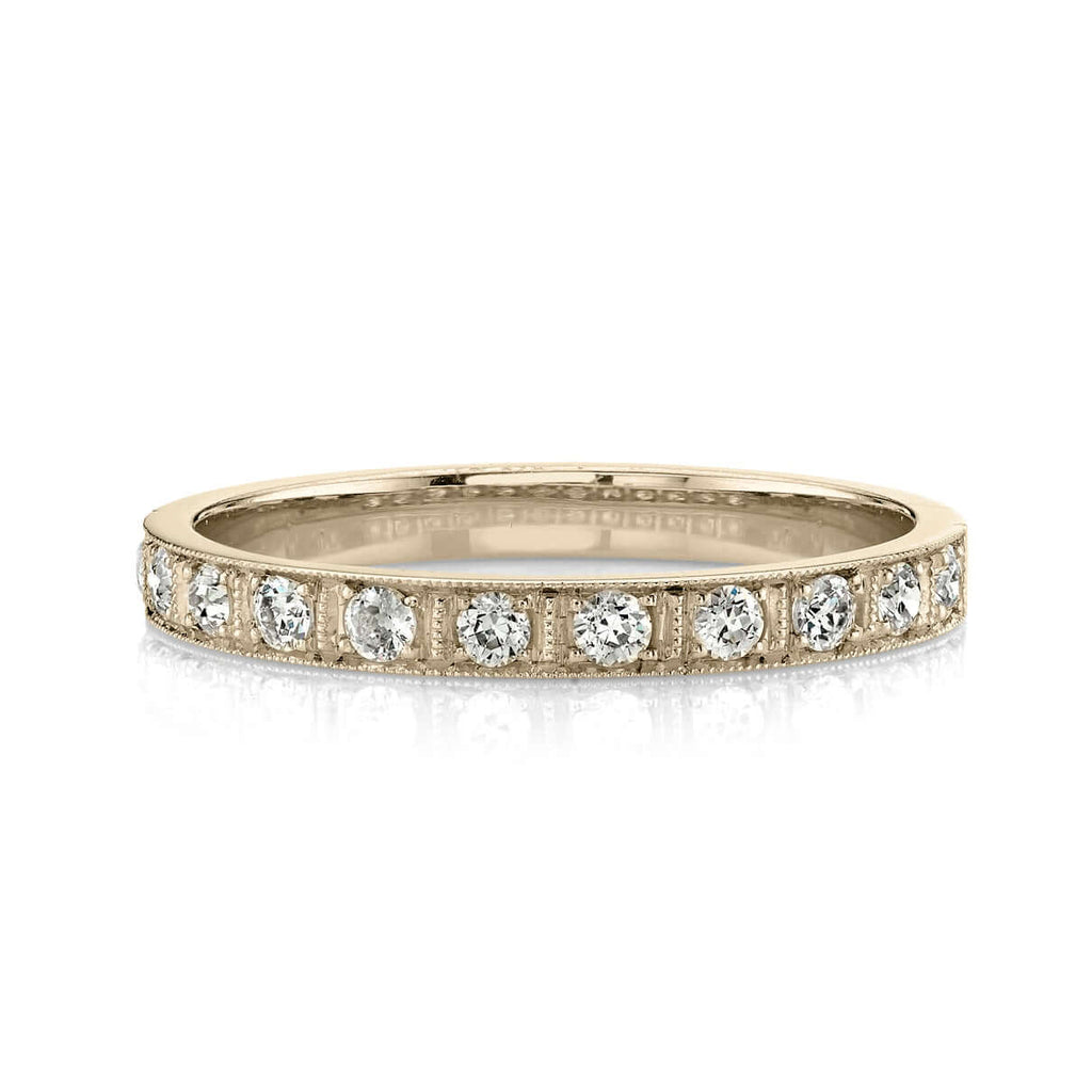 Single Stone's HADLEY band  featuring Approximately 0.20ctw G-H/VS old European cut diamonds prong set in a handcrafted half eternity band. Approximate band width 2.3mm. Please inquire for additional customization.
