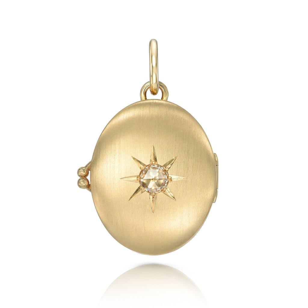 
Single Stone's Harmony locket pendant  featuring 0.43ct G-H/VS rose cut diamond set in a handcrafted 18K yellow gold locket pendant.
Price does not include chain.
